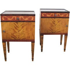 Elegant pair of Swedish art deco birch and mahogany nightstands.