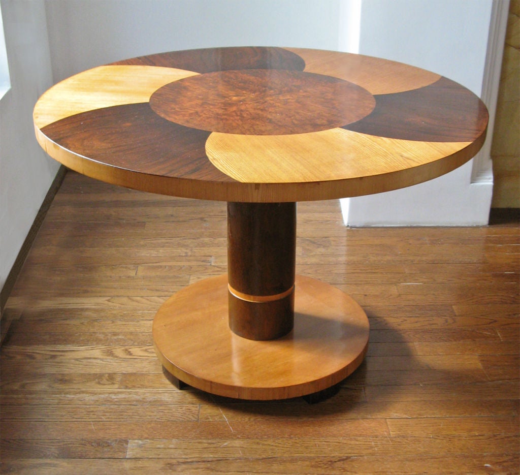 Swedish modernist art deco pedestal side table design attributed to Axel Einar Hjorth (unsigned) for NK, Stockholm. Great graphical use of rosewood, chestnut and chestnut root veneers. Made circa 1930. Dimensions H: 24”, Diameter: 35 1/2