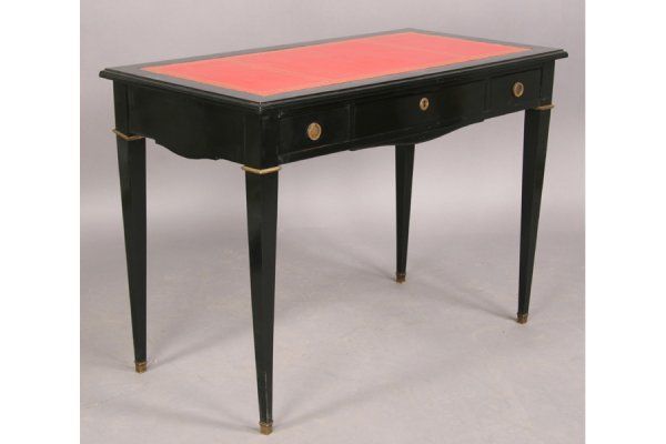 JANSEN BLACK LACQUER WRITING DESK RED LEATHER <br />
Jansen Directoire style writing desk with red leather inset top over drawers supported on bronze mounted tapered legs circa 1940. Gold embossed detail on leather makes this piece a classic.