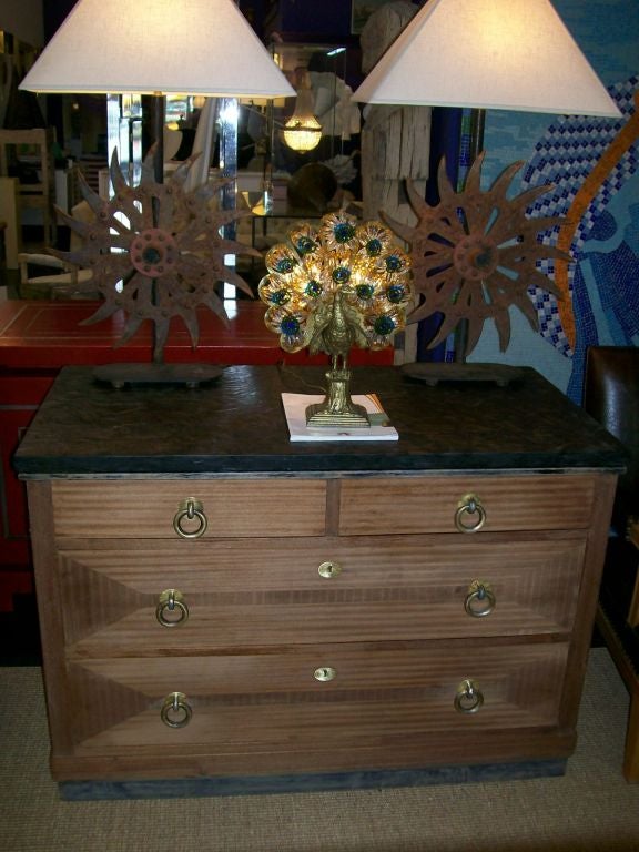 Extremely well crafted dresser with beautiful bronze hardware (original patina) and amazing volcanic ash matrix top (extremely rare).  Includes two large lower drawers with locks (no keys) and the two smaller top drawers are with all clear glass
