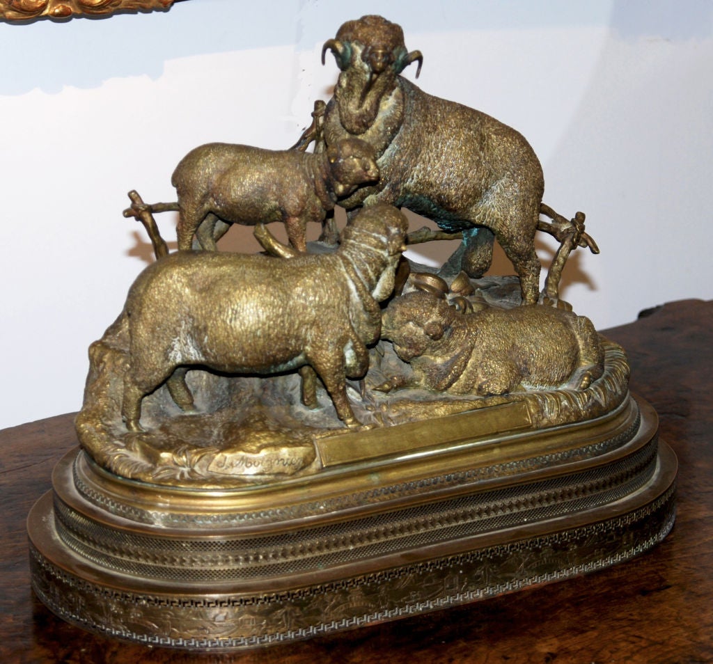 A Bronze Figural Group of Rams

Signed Jules Moignez 

The four figures standing on a naturalistic base having a golden patina

Jules Moignez began displaying his works at the Universal Exhibition in 1855.  He regularly exhibited at the Salon