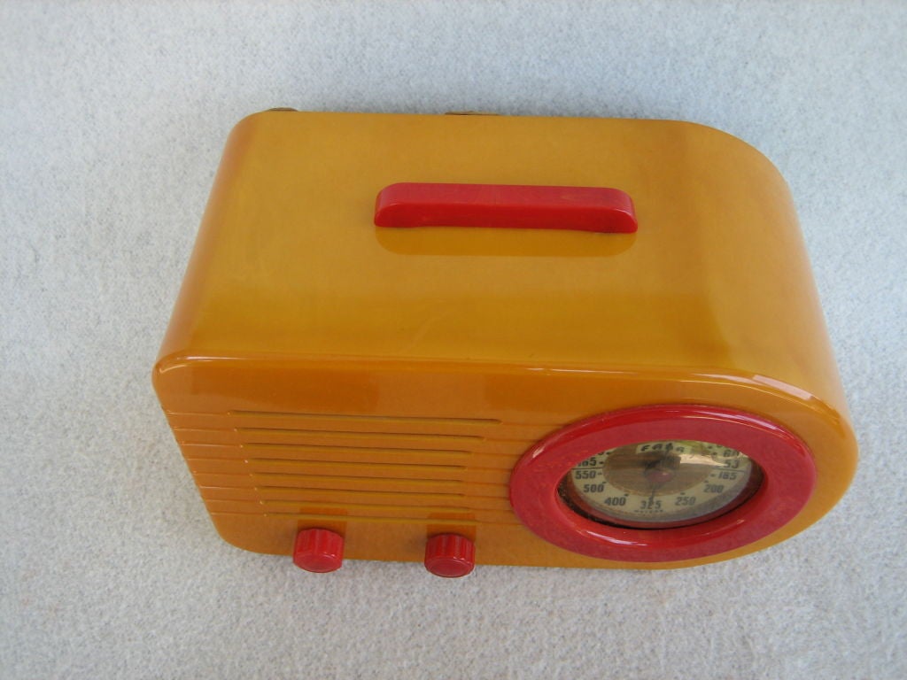 We were lucky enough to come across a collection out of an estate of wonderful pristine period art deco radios. This 1946 Fada Model 1000 Bullet Radio Butterscotch and red Bakelite is a true classic, exempliflying the stream lined designs of the Art