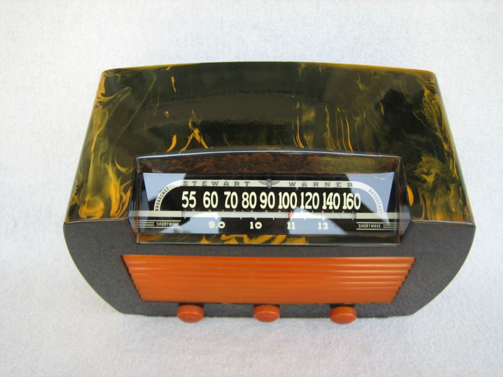 This is a beautiful dark green or blackish color radio with dramatic yellow Marblization and yellow grille and knobs. It is all original with no cracks, chips, breaks or repairs. You will not find a nicer example of this classic Bakelite radio. Size