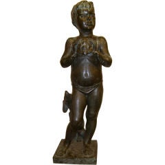 Life size bronze of a boy aand dog holding turtle by E. Hoffman