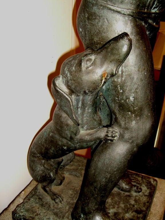 Life size bronze of a boy aand dog holding turtle by E. Hoffman 1