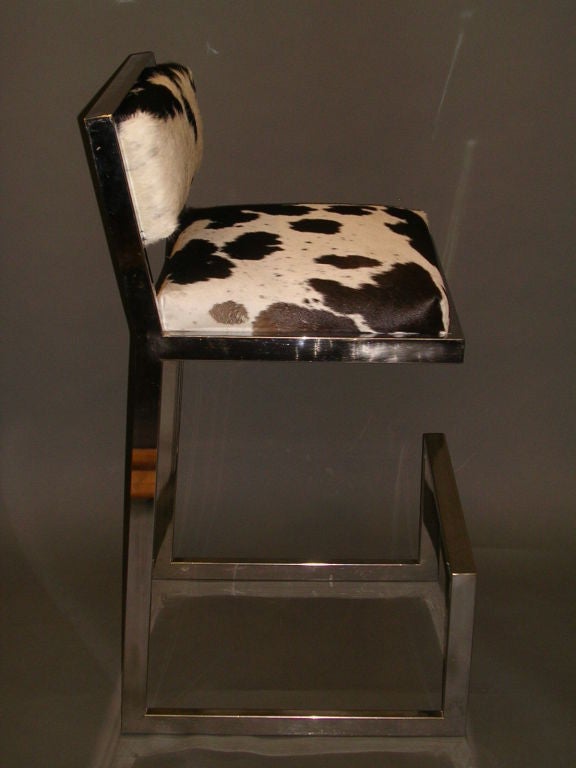 A set of four 1970's chrome bar stools with upholstered seats and padded backs. The lead photo shows duplication of one stool. For actual fronts and backs of each item, see detail photographs below.