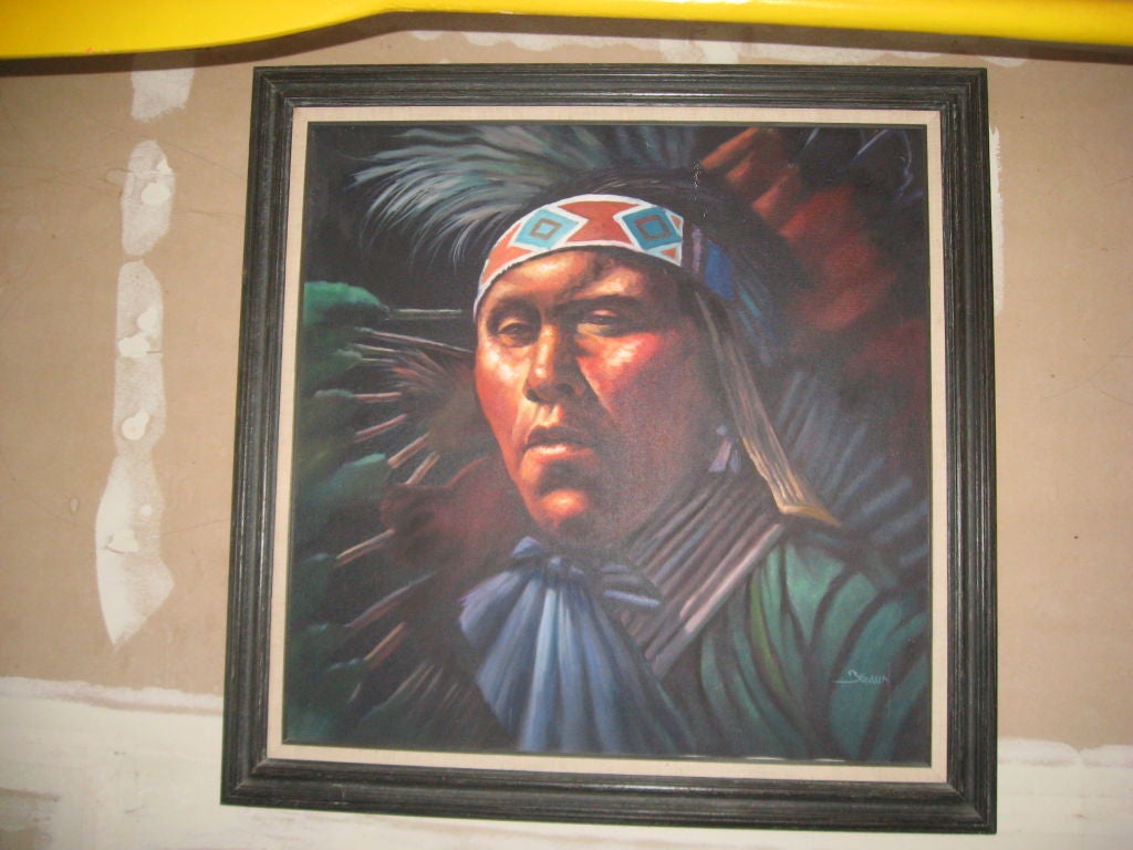 Puissante huile sur toile réaliste d'Amérindien signée Braun dans un cadre en bois noir sculpté.