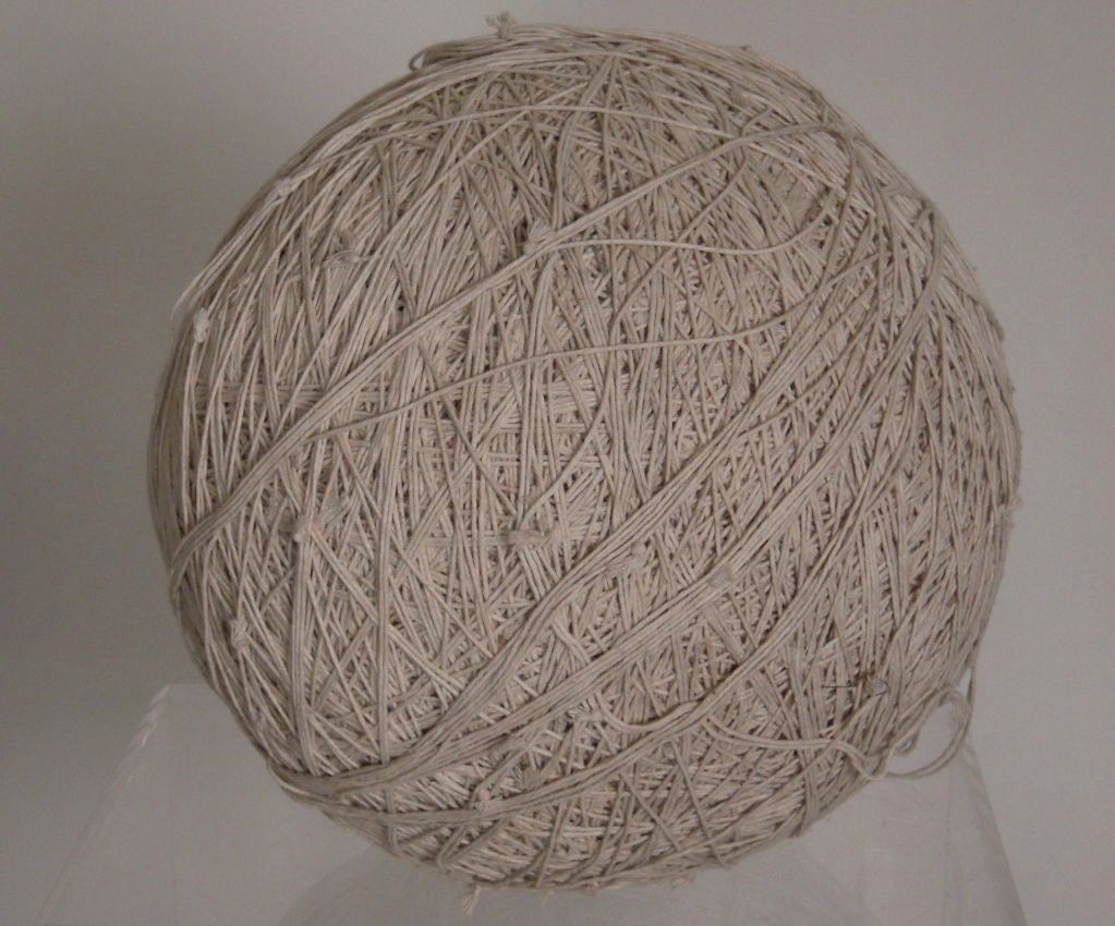A vintage, large solid ball of tied string, collected over years by a factory or mail room worker. Wonderful, obsessive (!) sculptural object.