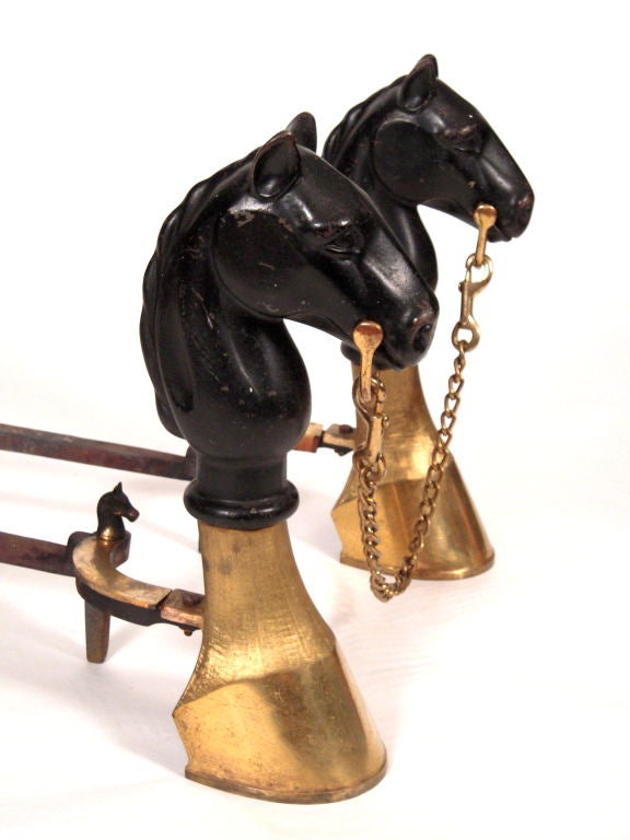American STYLISH PAIR OF IRON AND BRASS HORSE ANDIRONS WITH FIRETOOLS