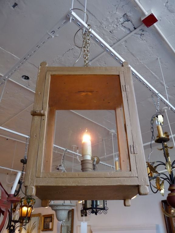 An unusual rectangular painted lantern with a latched door.