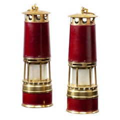 Pair of burgundy leather, brass and Baccarat glass lamps