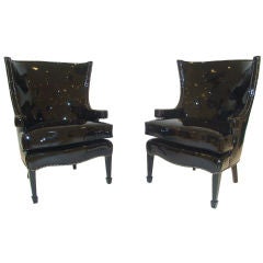 Pair of wing chairs in black patent leather