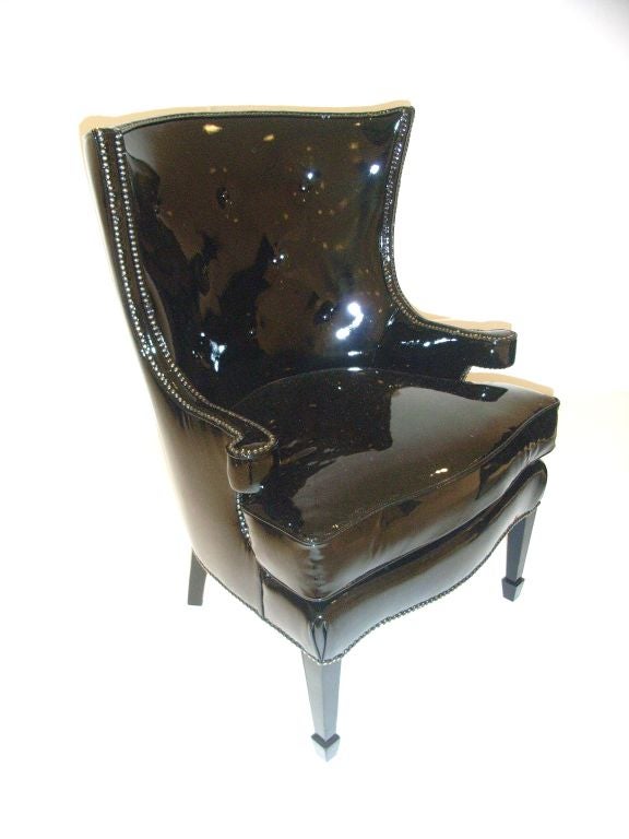 Pair of wing chairs in black patent leather