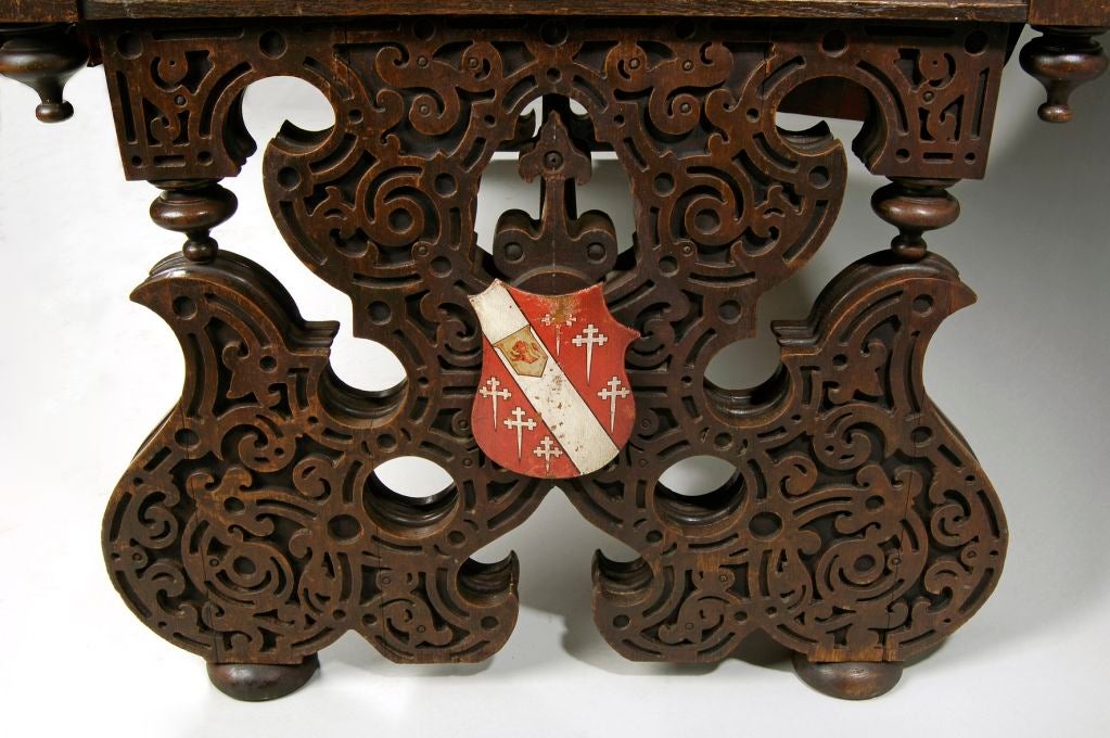 Elizabethan revival oak library table designed by C J Richardson for Greystoke, Cumbria, one of the seats of the Howard family. Armorial shields bear the Howard coat of arms. This table is very similar to one exhibited by Richardson at the Great