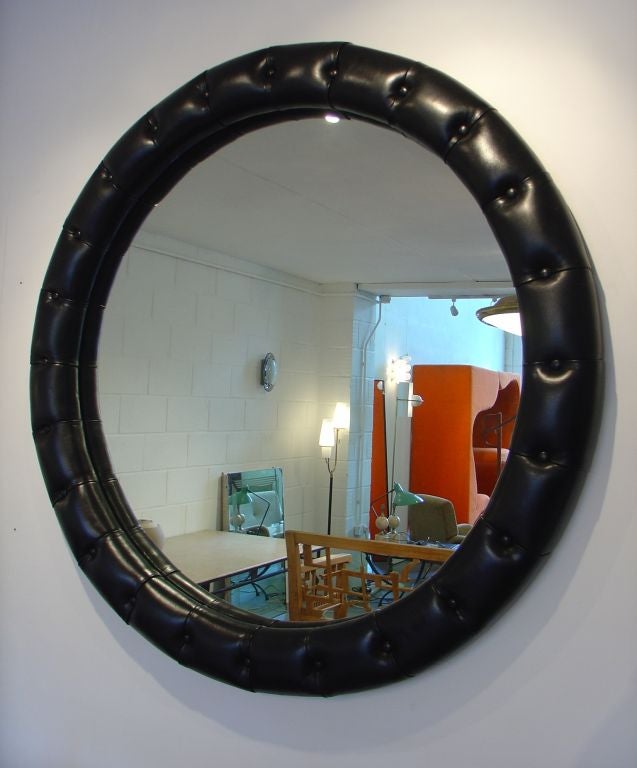 Buttoned leather framed mirror
