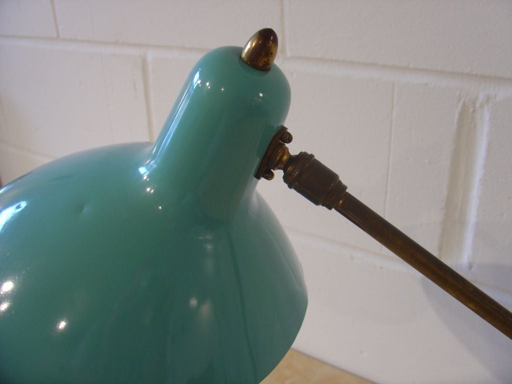 Turquoise painted metal adjustable table lamp with gilt metal details. Original paint. Rewired
