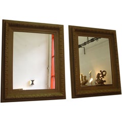 Pair of carved pine framed mirrors
