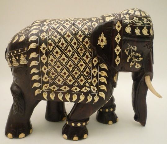 Large boldly carved Indian rosewood elephant with dramatically patterned bone inlay , late 19th Century<br />
 Please note: VAT charges apply if purchased within EU