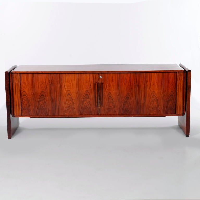Dorty Dyrlund Rosewood `Floating` Credenza, Denmark, c1968<br />
<br />
Dyrlund, the Danish luxury furniture maker, has a reputation for producing the finest quality office furniture and this magnificent credenza with rolling doors is no exception.