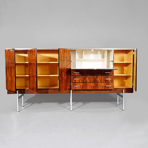 Rosewood Credenza by Herbert Hirche, W. Germany c1960s.<br />
<br />
Herbert Hirche started his career as a carpenter's apprentice during the early 1930s at the Bauhaus in Dessau where he studied under different teachers such as Wassily Kandinsky
