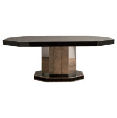 A Black Lacquered Octagonal Extendable Dining Table