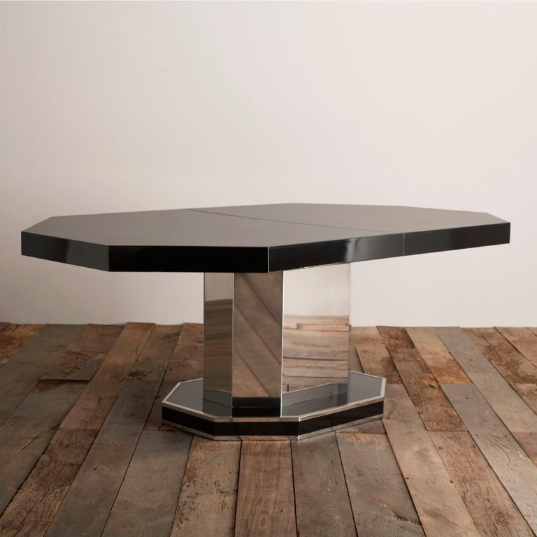 A Black Lacquered Octagonal Extendable Dining Table