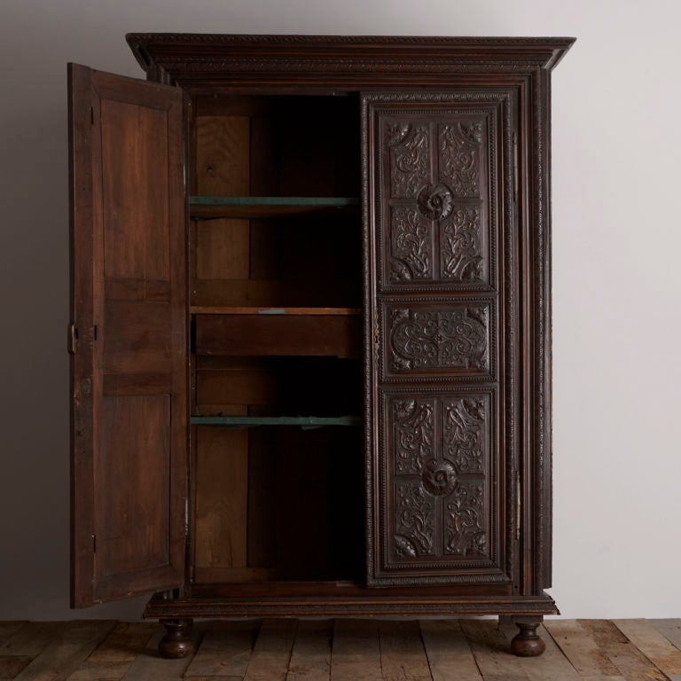 A Late 18th Century French Walnut Armoire Elaborately Carved Thr