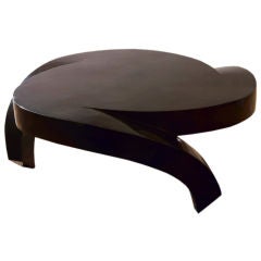 A Biomorphic Black Fossil Stone Veneered Coffee Table