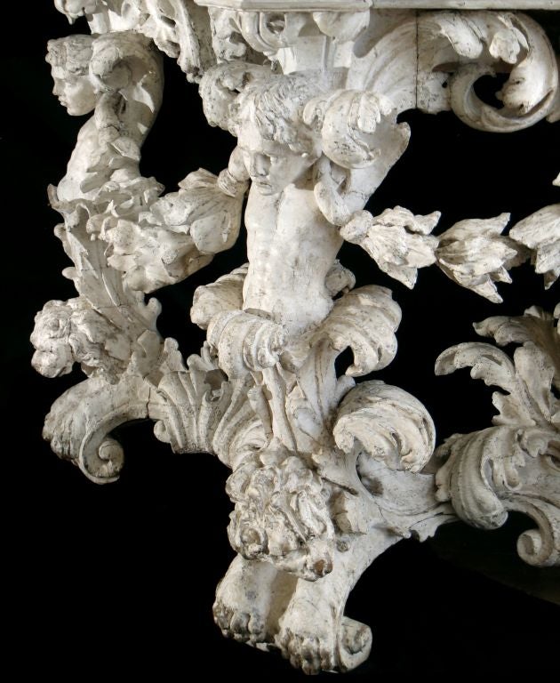THE SHAPED AND MOULDED BRECHE VIOLETTE MARBLE TOP HAVING <br />
OUTSET SQUARED CORNERS<br />
THE TABLE IS RICHLY CARVED AND DECORATED THROUGHOUT <br />
THE MOULDED AND CARVED APRON  HAVING  SCROLLING  LEAF MOTIFS <br />
CENTRERED  UPON A MALE
