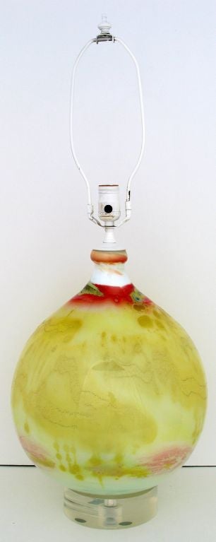 Vibrant color and unusual in shape, this yellow, white and red hand blown glass table lamp is glass blowing as art form. Possibly from Murano.  Sold sans shade.