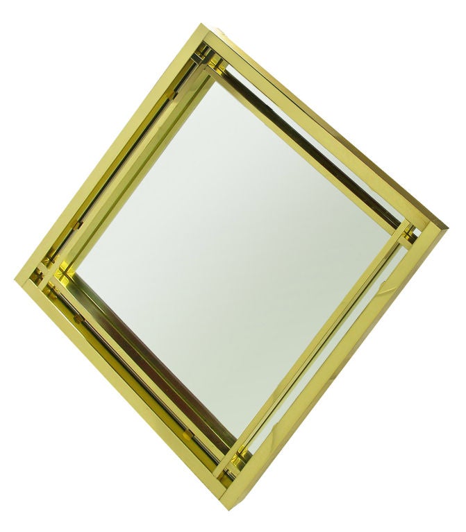 Elegant modern diamond shaped double framed mirror with open crossed corners in the style of Pierre Cardin. Excellent build quality and substantial, the mirror is outfitted with heavy duty hangers in verso.  Acquired from an estate that included the