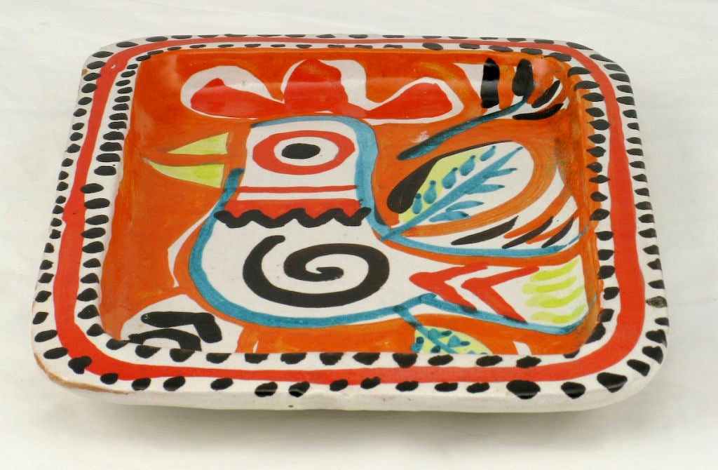 Vivid Italian pottery hand painted tray, depicting an abstract stylized rooster. The tray was made in Italy for the legendary Joseph Magnin Company department store. Established in San Francisco in the early part of the 20th century, the founder was