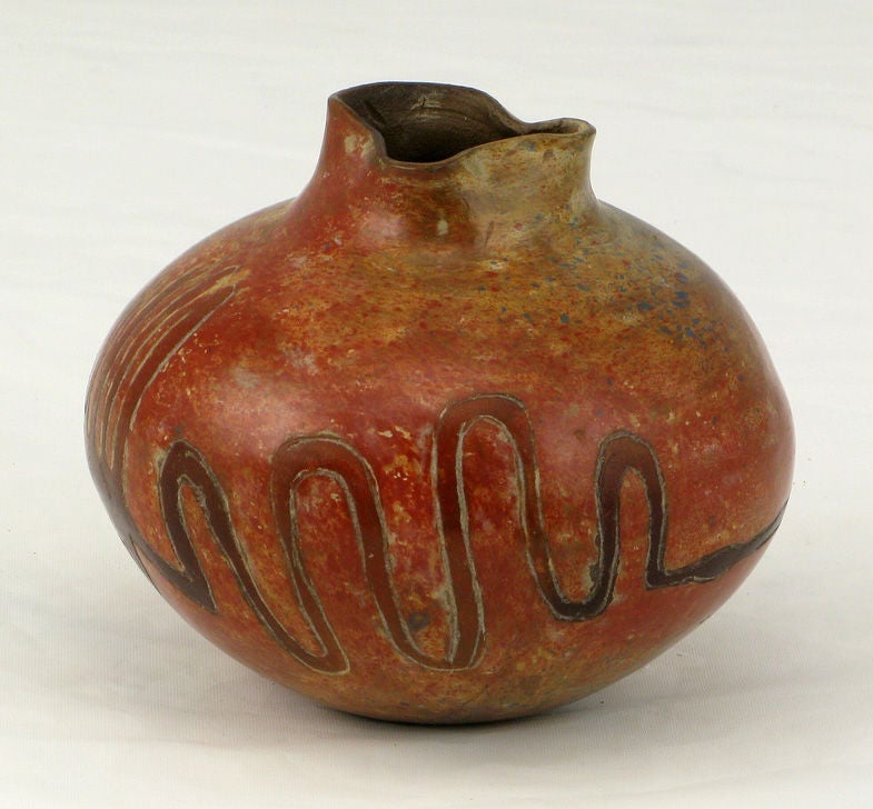 Nazca Lines designs adorn this colorfully glazed ceramic work by the Peruvian artist, Julio Flores.  Signed, and dated 1994.