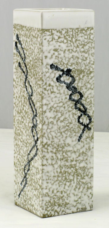 Square columnar pottery vase in a heathered white glazed finish with a black intertwined line design. Signed