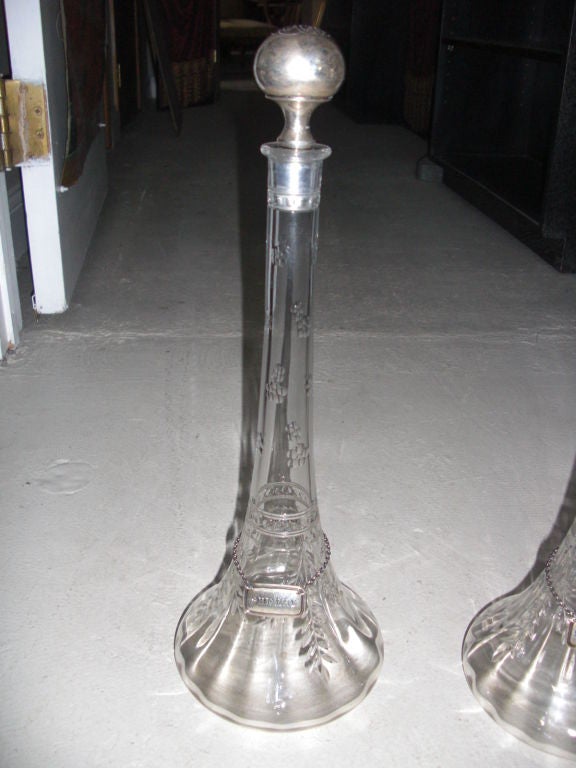 Pair of  oversize wheel cut  crystal and silver decanters