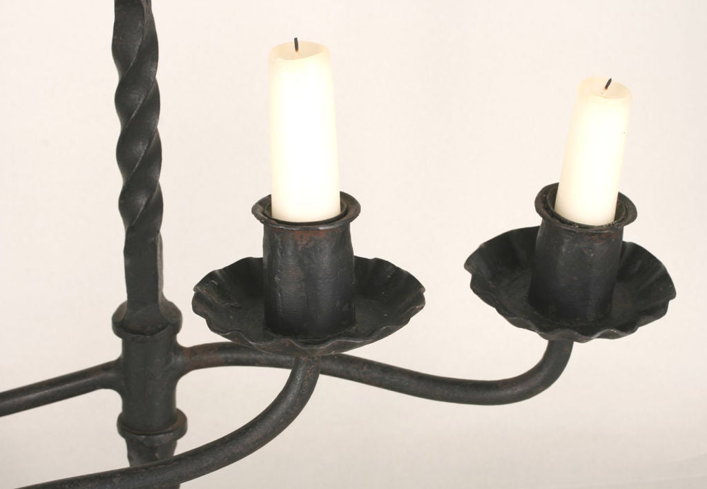 Pair of Wrought Iron Swiveling Candlesticks 1