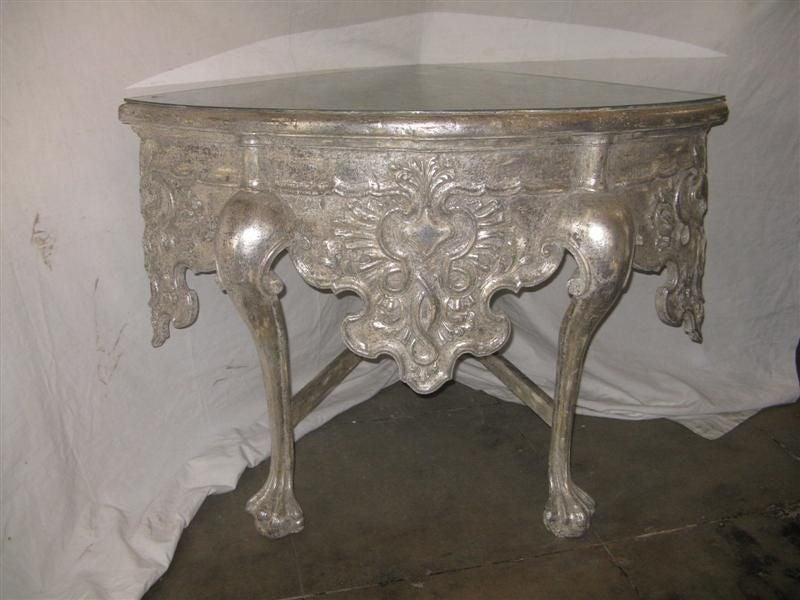 Grand carved silver leaf corner piece with beautifully carved front, scrolled legs, and claw & ball feet.  This piece would make a great pullman for a sink in a powder room.