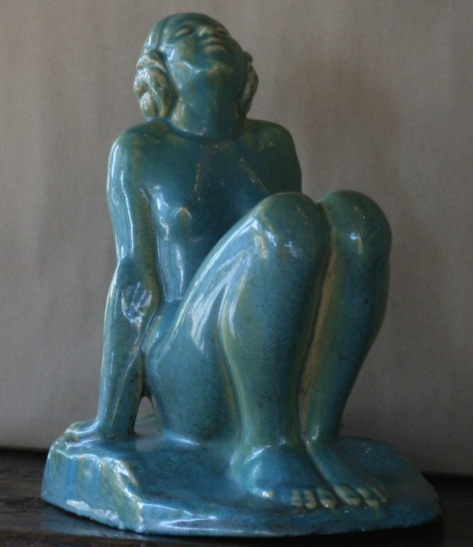 Voluptuous woman leaning back on her hands and looking up to the heavens. Made by a prominent California architectural pottery company; Gladding, McBean.