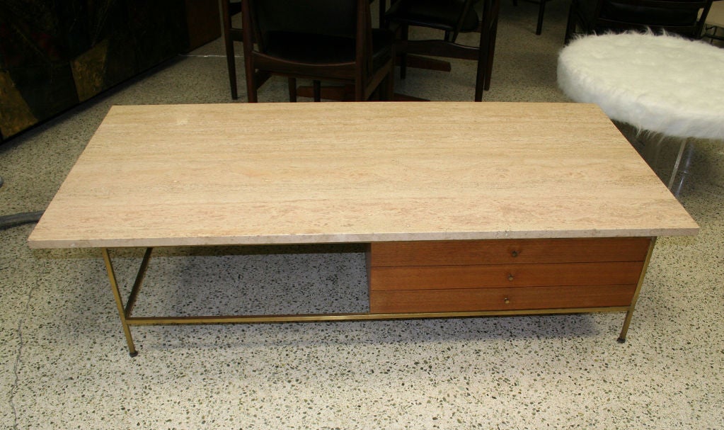 Paul McCobb Italian Travertine Top Coffee Table<br />
with 3 drawers.Signed with metal manufacturer's<br />
label to drawer interior