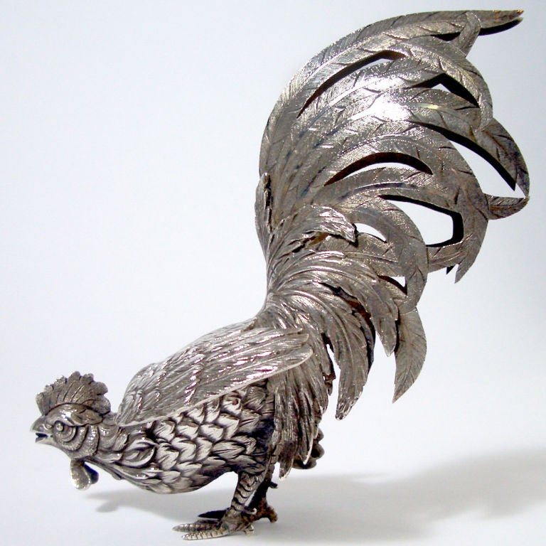 Exquisite pair of realistically detailed silver roosters with finely textured feathers. Stamped with maker's mark and 833 silver.