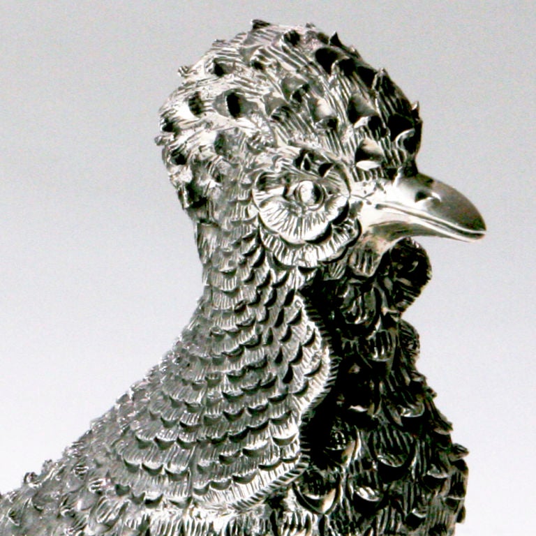 A beautiful pair of sterling silver pheasants designed in a distinctive 