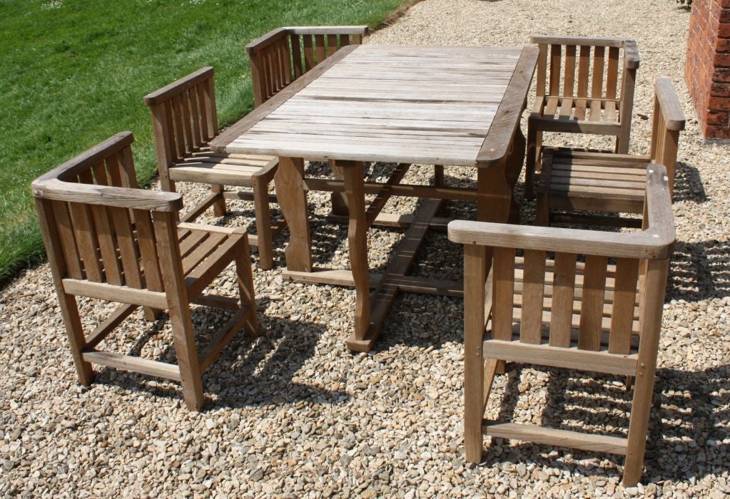 A rare 1930's 6 seater teak garden table designed by Ambrose Heal for Heals.<br />
In very good original condition and ready to use.<br />
Joints on all the chairs and the table are sound.