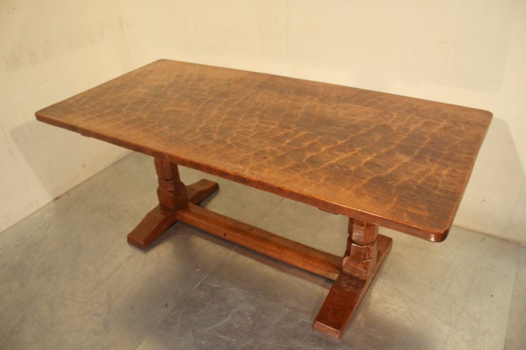 An original 1930's Robert Thompson, the 'Mouseman' dining table. <br />
Robert Thompson ran his workshops from Kilburn, Lancashire, England, from around 1919. He initially made church furniture, but then went on to make all types of furniture for