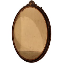 An English lacquered round mirror c1850