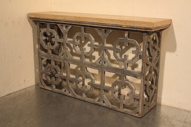 A European Console table c1860 with chain link frieze design and original grey paint, with a bath stone top.