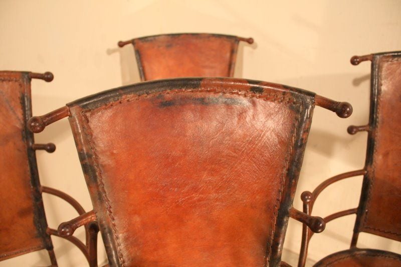 A 1920’s/30’s pair of French iron and leather designer chairs