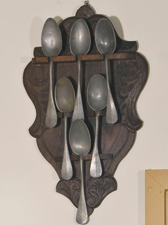 Wood carved Oak Belgianspoon holder with pewter spoons