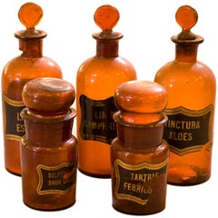 Selection of antique handblown glass apothecary bottles