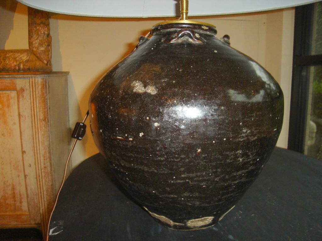 Handsome Glazed jar from Rajastan made into a lamp. Newly French wired with off/on, high/low inline switch. Linen shade.