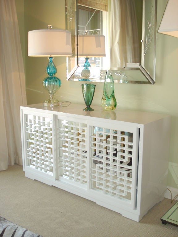 Ivory Lacquered Japanesque Commode<br />
with Mirrored Fretwork Sliding Doors